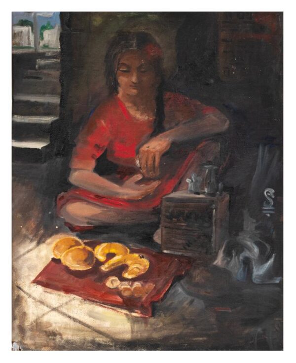 מוכרת לחמניות ברחוב. היא יושבת על המדרכה ולפניה על שטיח קטן מונחות לחמניות למכירה.